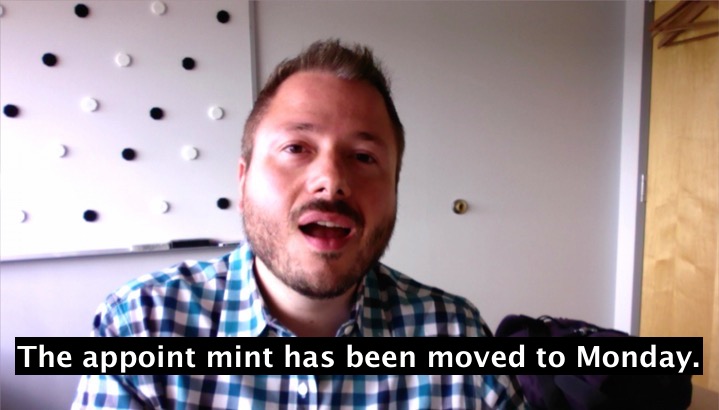 Still image from a video of a man speaking while looking at the camera with caption text below that says The appoint mint has been moved to Monday