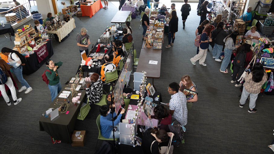 Several vendors selling products to the R I T community at a craft fair.