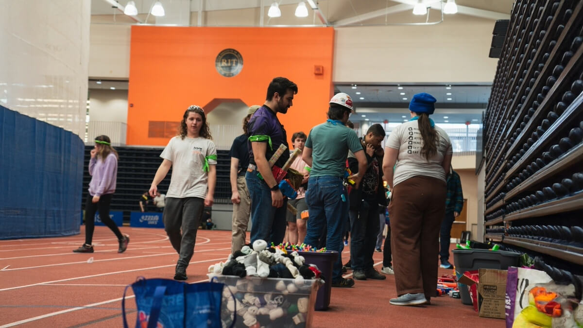 Students prepare for a game of Humans vs. Zombies at the Gordon Field House 