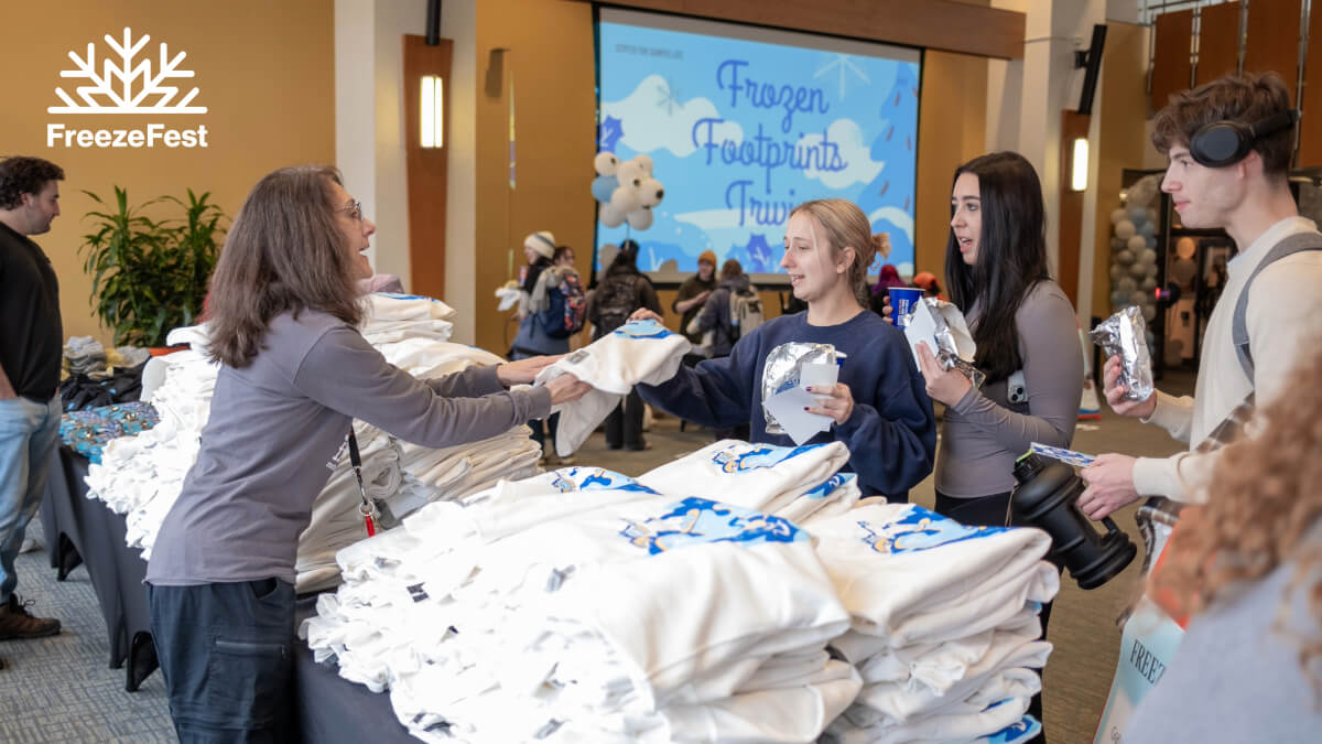 Merchandise being handed out to students during a FreezeFest event