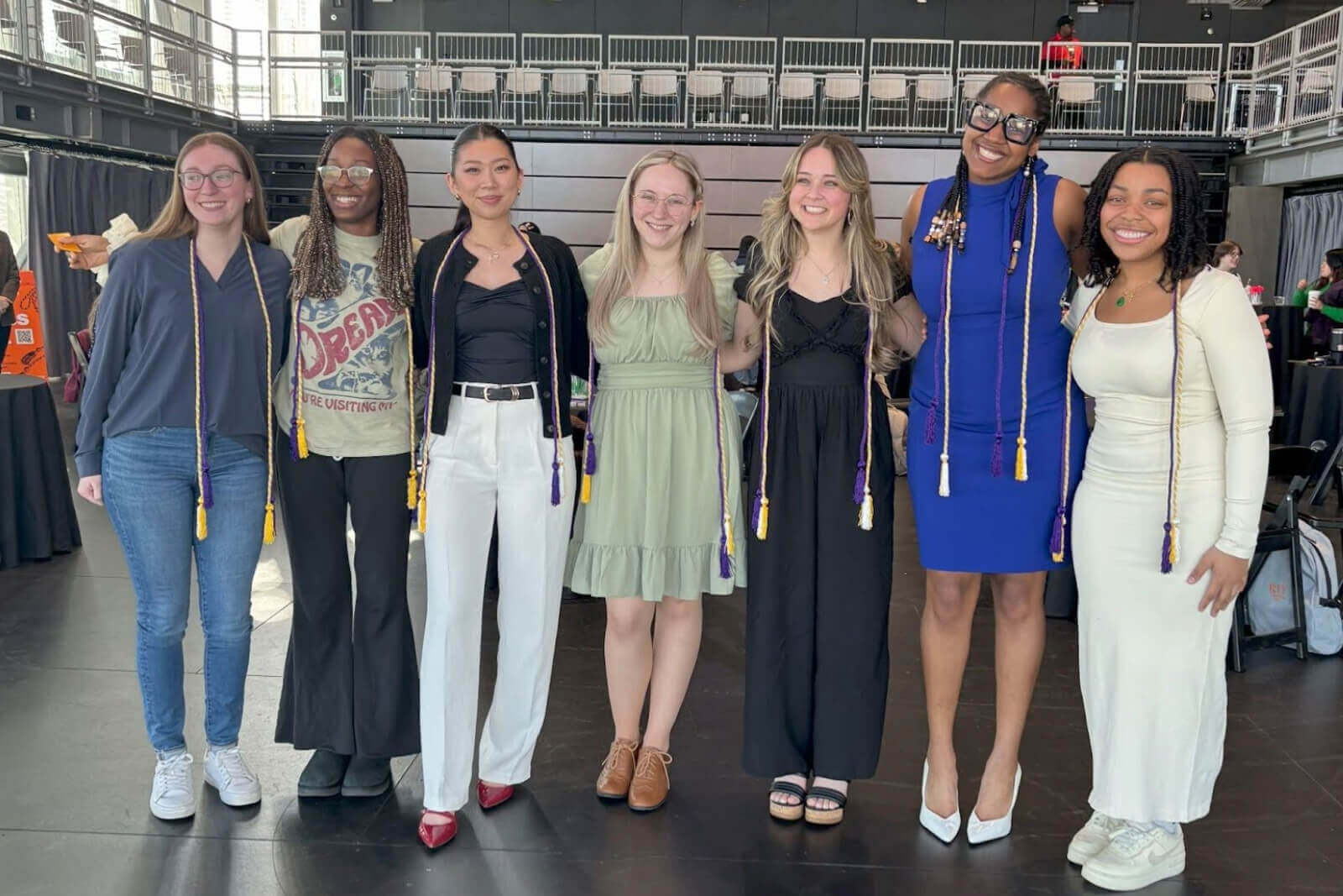 Students posing for the camera during the Passing the Torch graduation celebration