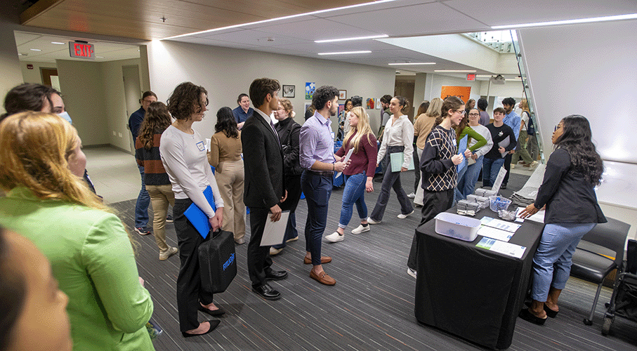students in line waiting to speak to a recruiter