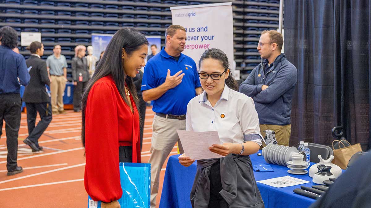 a student talks to a recruiter at R I T's fall career fair.