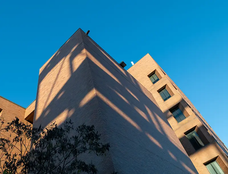 Dramatic angle, looking up at the exterior of the Eastman Building.