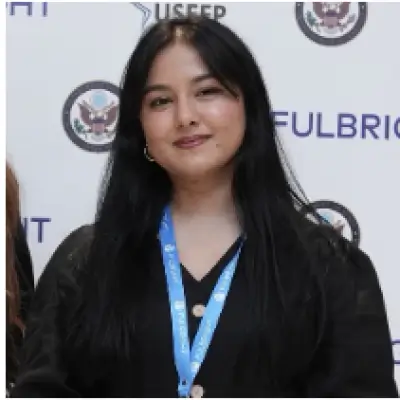 Headshot of Zainab Mangi.