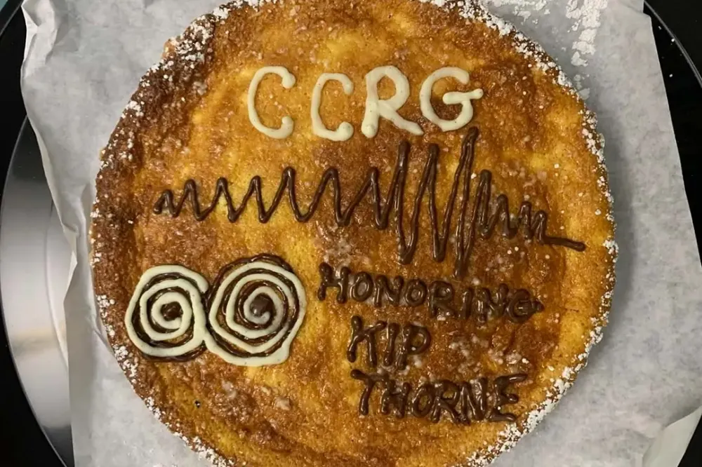 A pie decorated with the words, C C R G honoring Kip Thorne.
