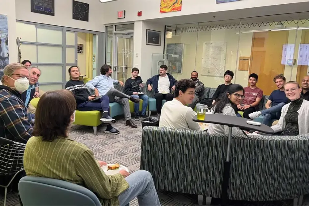 Several people sitting in a lounge area.