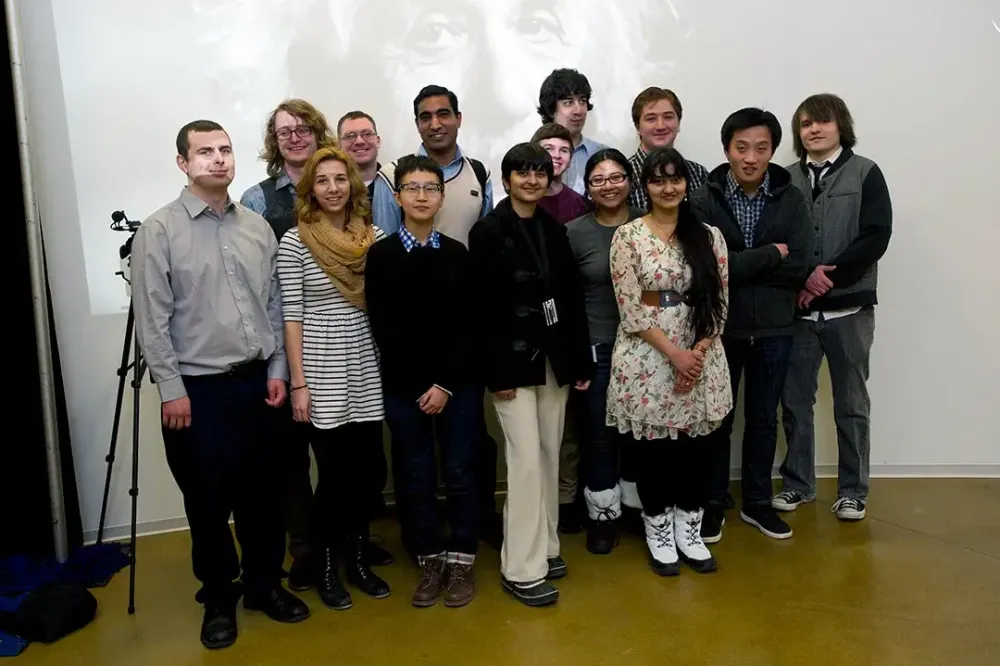 A group of students and researchers poses for a photo.