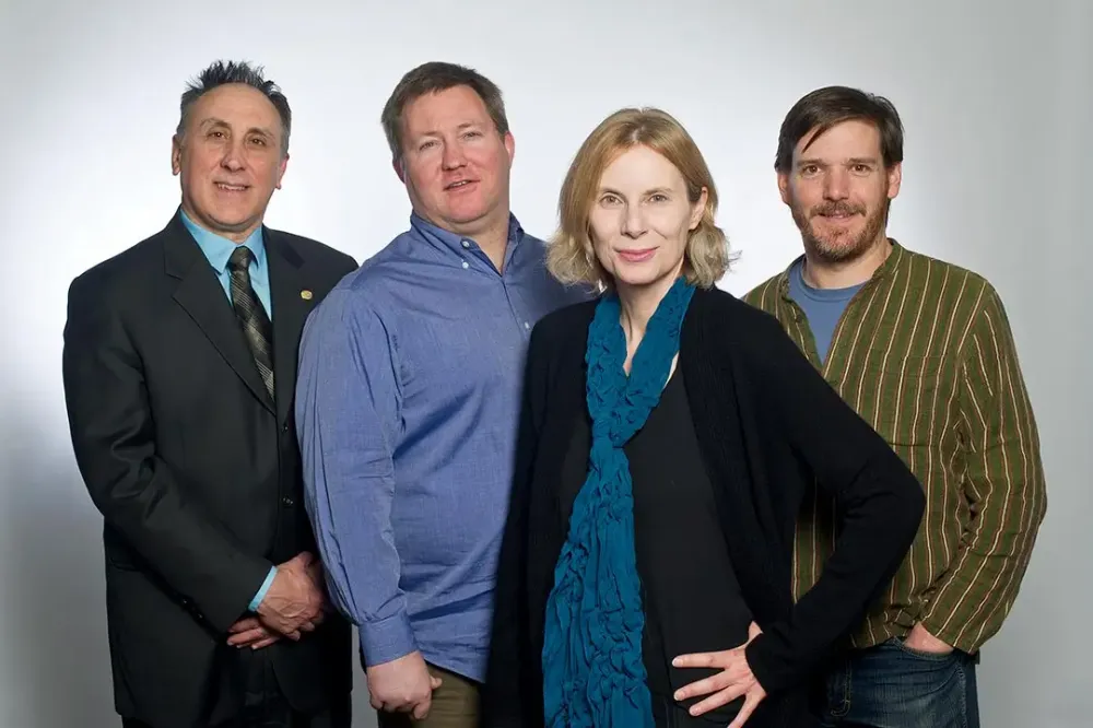 Four lead researchers pose for a photo.