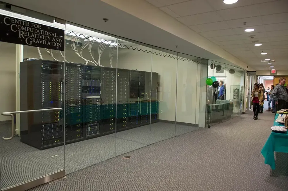 A server room with one wall of glass.