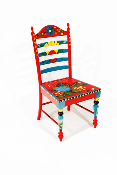 Red chair with brightly colored flowers