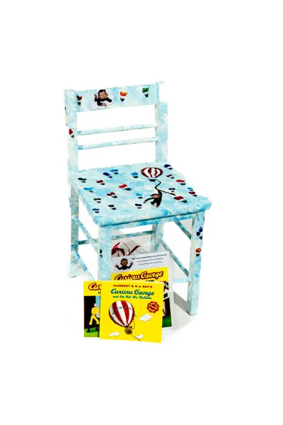 Curious George and the Hot Air Balloon books, the chair has Curious George images and hot air balloons made of children's fingerprints connected to balloon baskets.