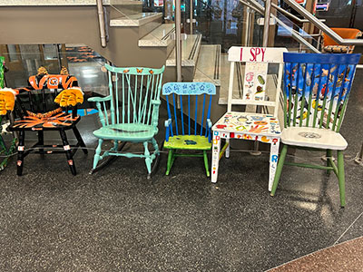 all of the chairs on display together