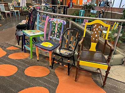 all of the chairs on display together