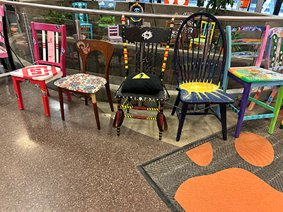 all of the chairs on display together