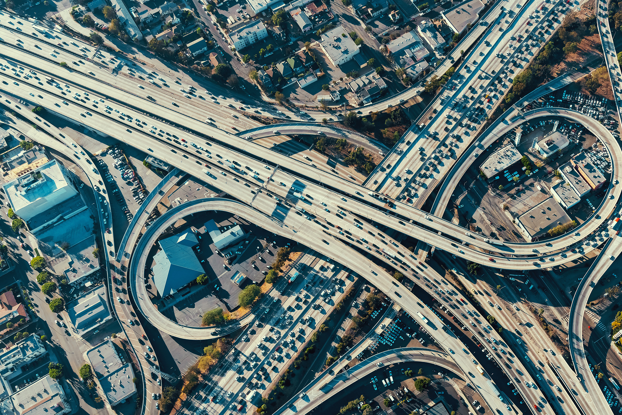 Urban highway system view from above with several crossing roads