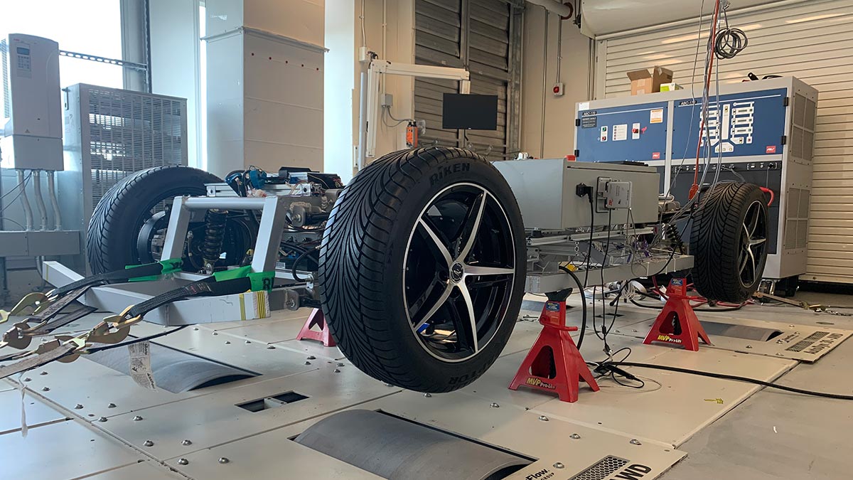 A vehicle chassis mounted on a testing rig.