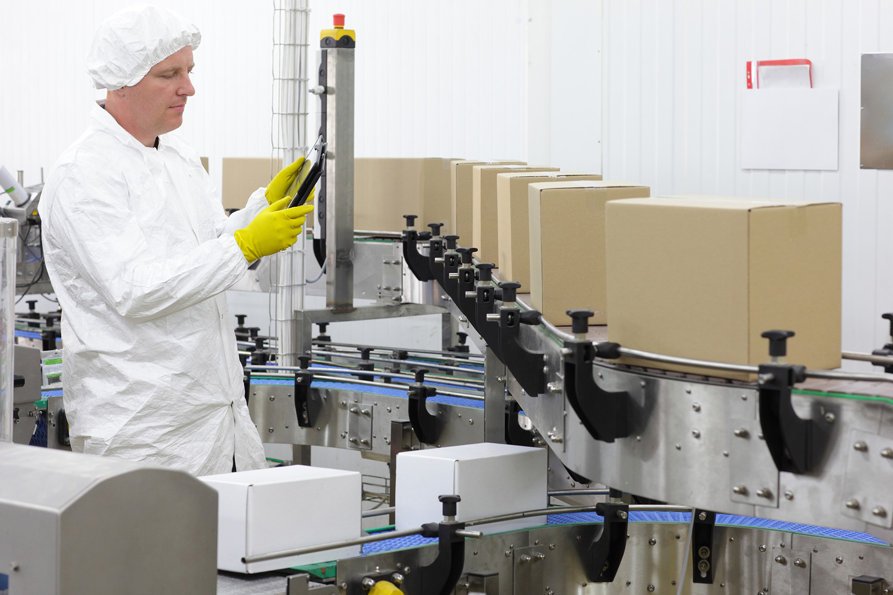 Person inspecting a production line