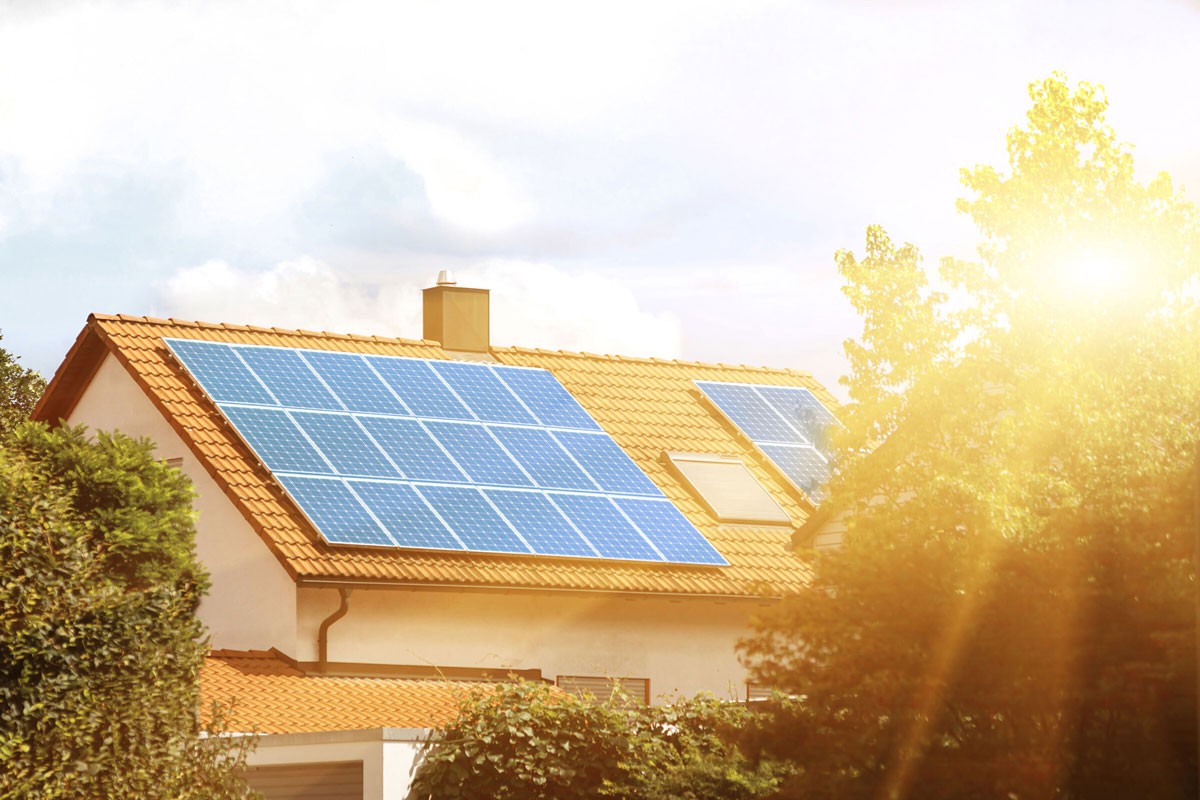 A residential building with solar panels attached to roof