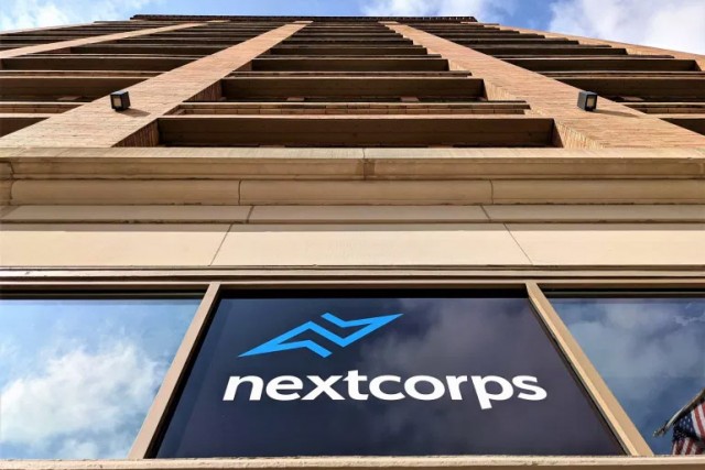 outside looking up at building that houses NextCorp.