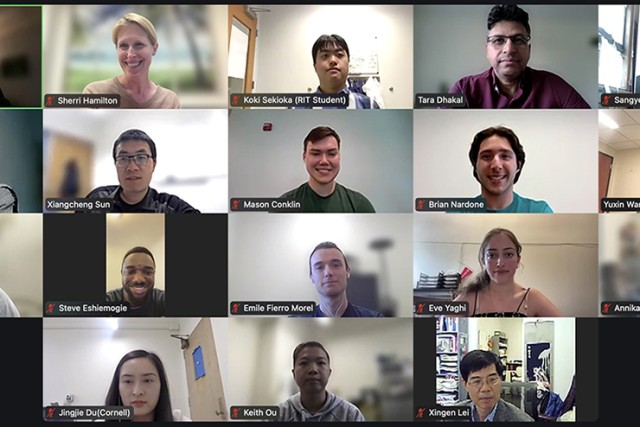 A screenshot of a group of students and faculty members during a live video call