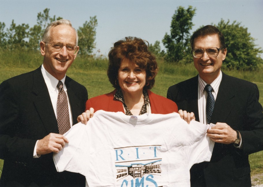 Louise Slaughter and RIT president holding CIMS tshirt