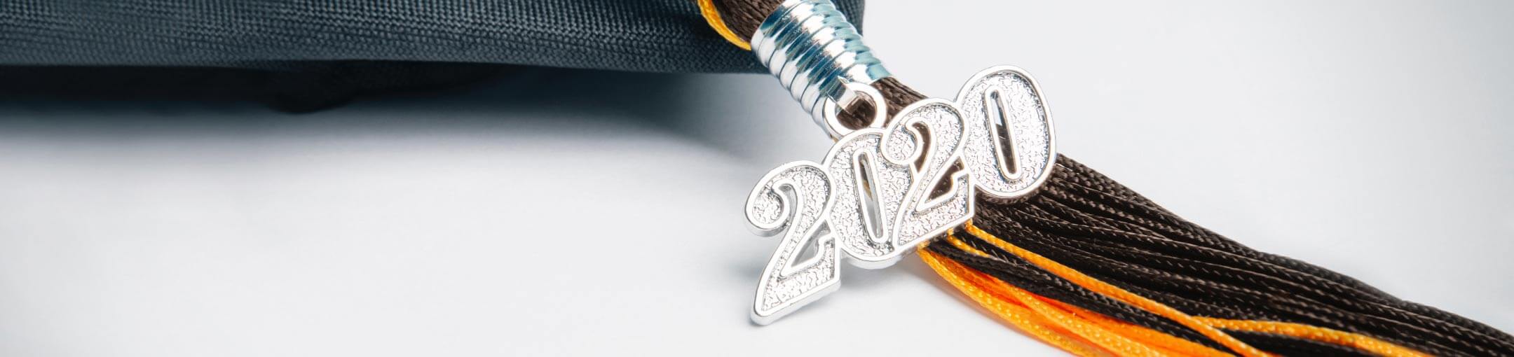 Graduation cap with orange tassel and the year 2020