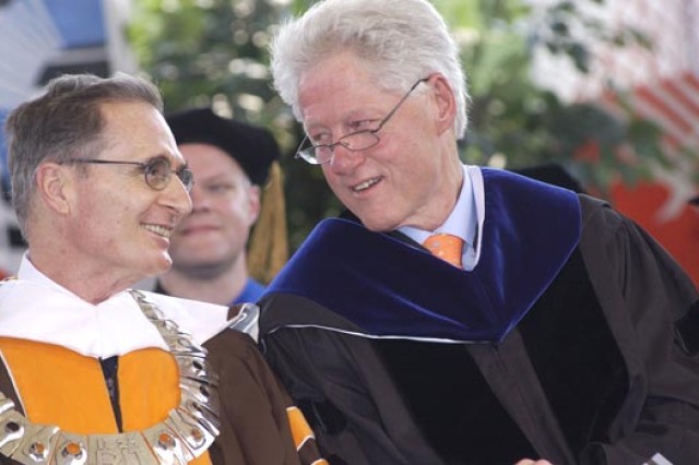 Bill Clinton talking to RIT President at graduation