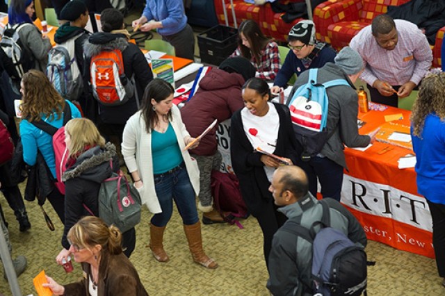 People walking around fair 