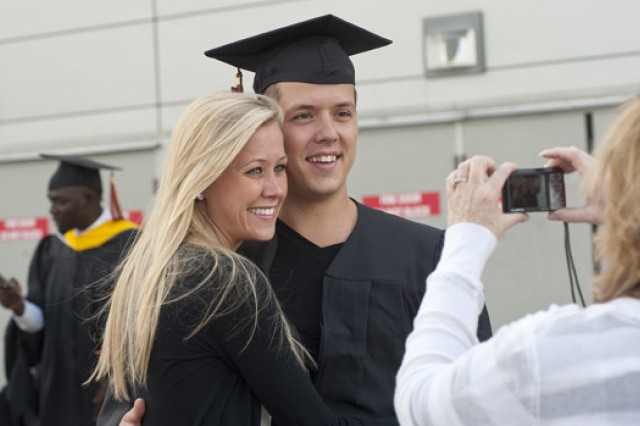 People posing for camera at graduation