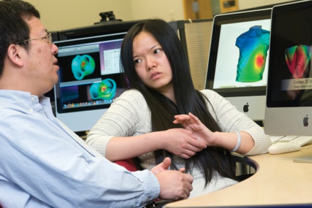 People looking at computer data