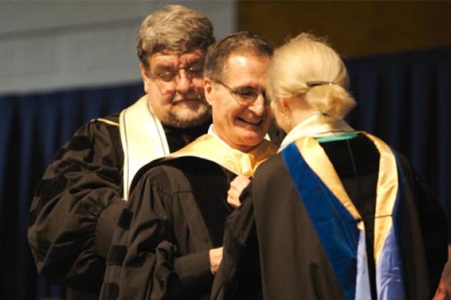 RIT President receiving award at ceremony