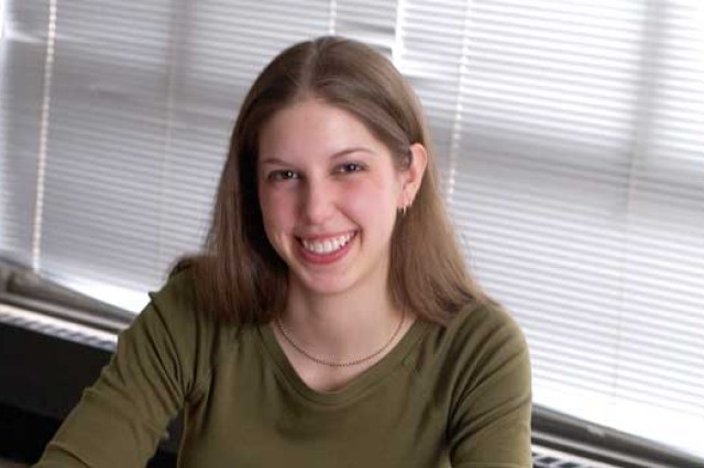 Graduate Student sitting in front of window