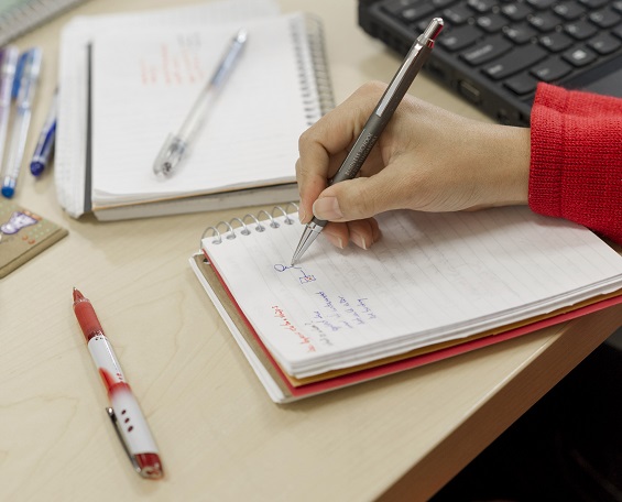 writing in notebook