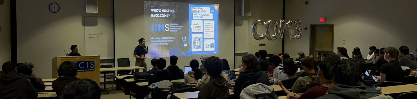 Opening ceremony at HACK.COMS, with multiple audience members at a large event