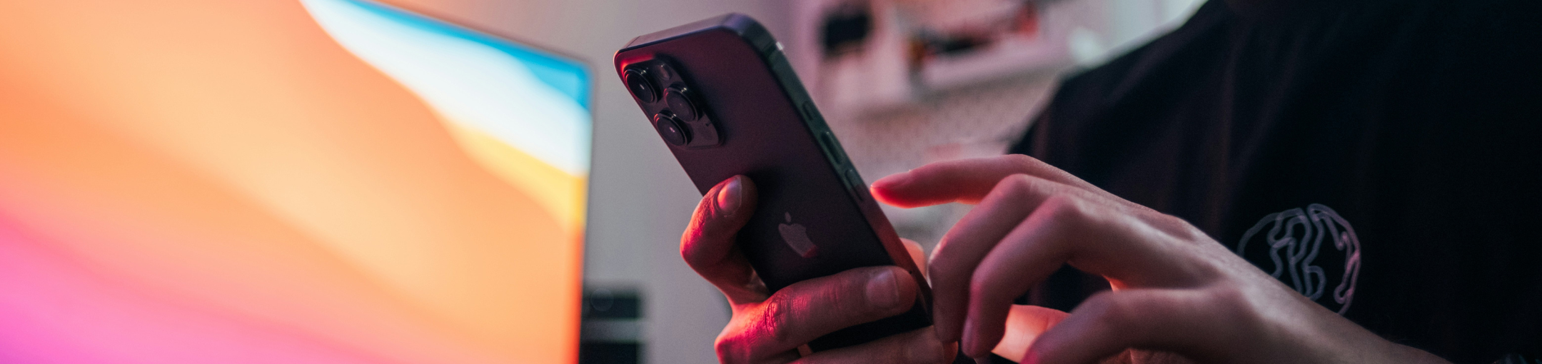 a pair of hands holding an iphone 