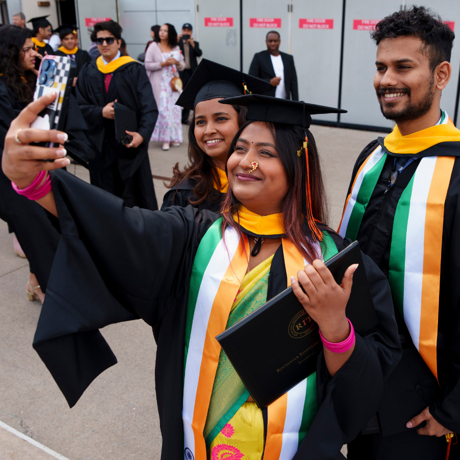 graduates taking selfie