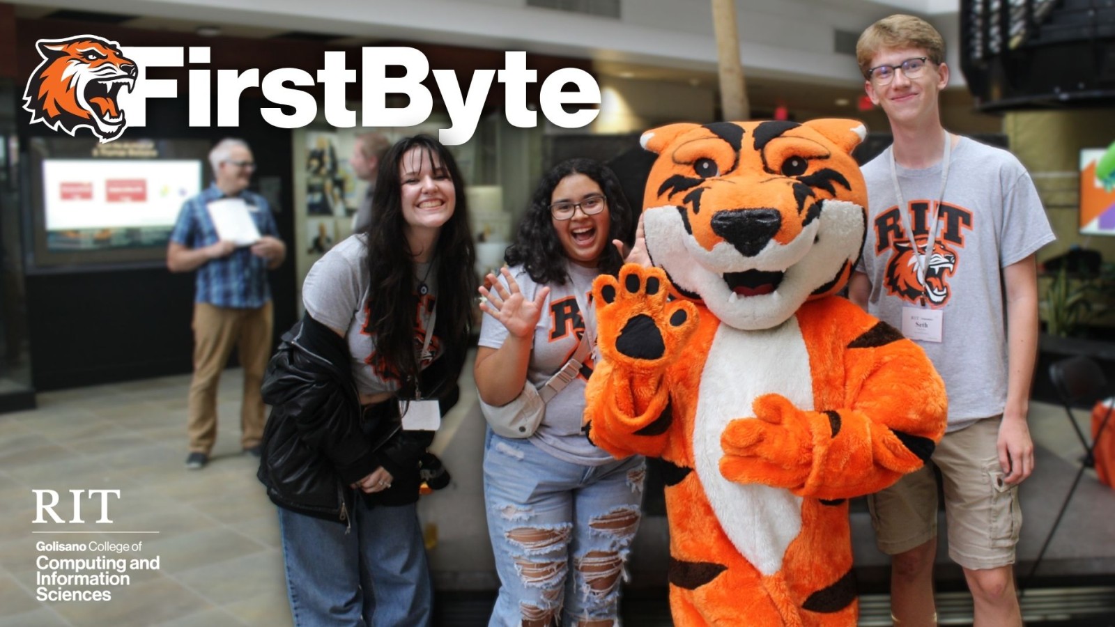 First-year students at the FirstByte Carnival with Ritchie. Text reads "FirstByte, RIT Golisano College of Computing and Information Sciences"