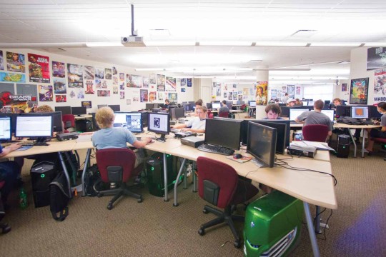 Students working at computers in a large room