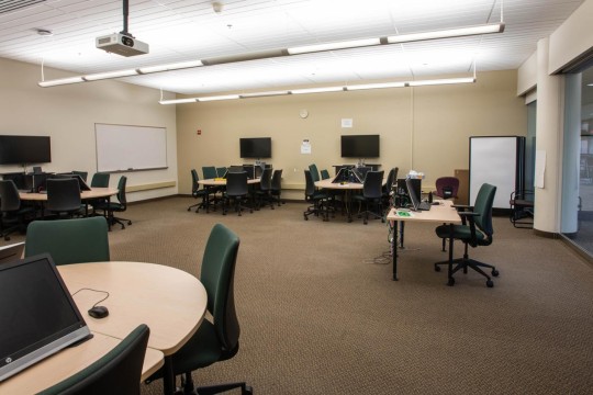 Open lab with small circular tables for collaboration