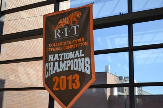 Flag displaying "Collegiate Cyber Defense Competition: National Champions 2013"