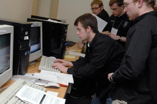 Students gathered around a computer