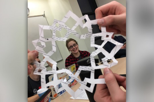 Picture of person framed by paper snowflake