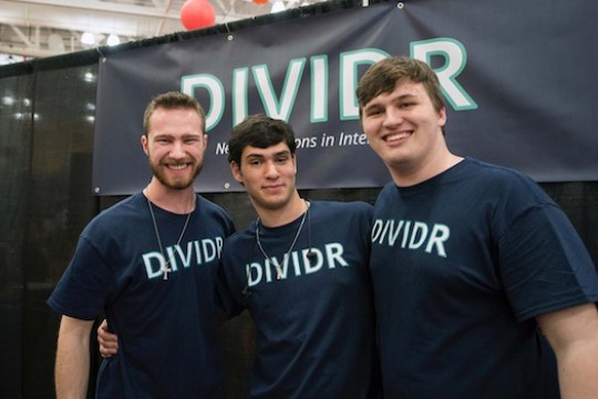 three people wearing T shirts that say D I V I D R.
