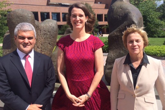 Dean Winebrake, Becky Wehle, and Anne Haake pose for a photo in front of an outdoor sculpture behind the College of Liberal Arts.