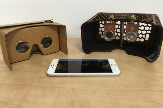 a smartphone and two pairs of virtual reality headsets.