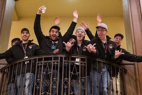 Team posing on balcony