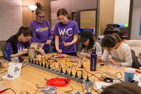 People working on experiment in classroom
