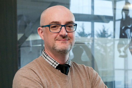 Head-and-shoulders view of man with glasses