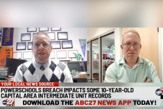 a split screen shows two men speaking on a zoom call.